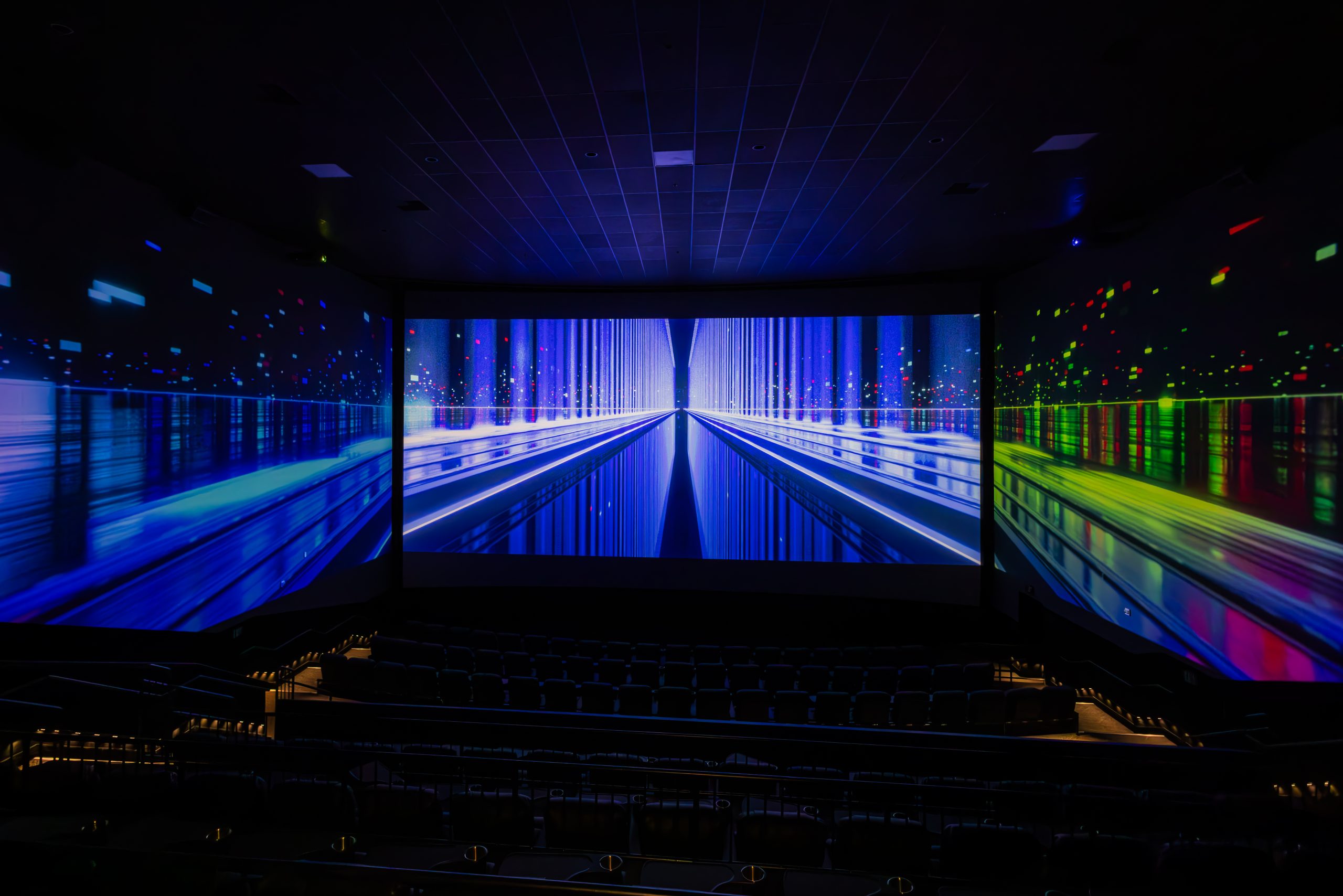 Empty theater with colorful effects on walls and screen